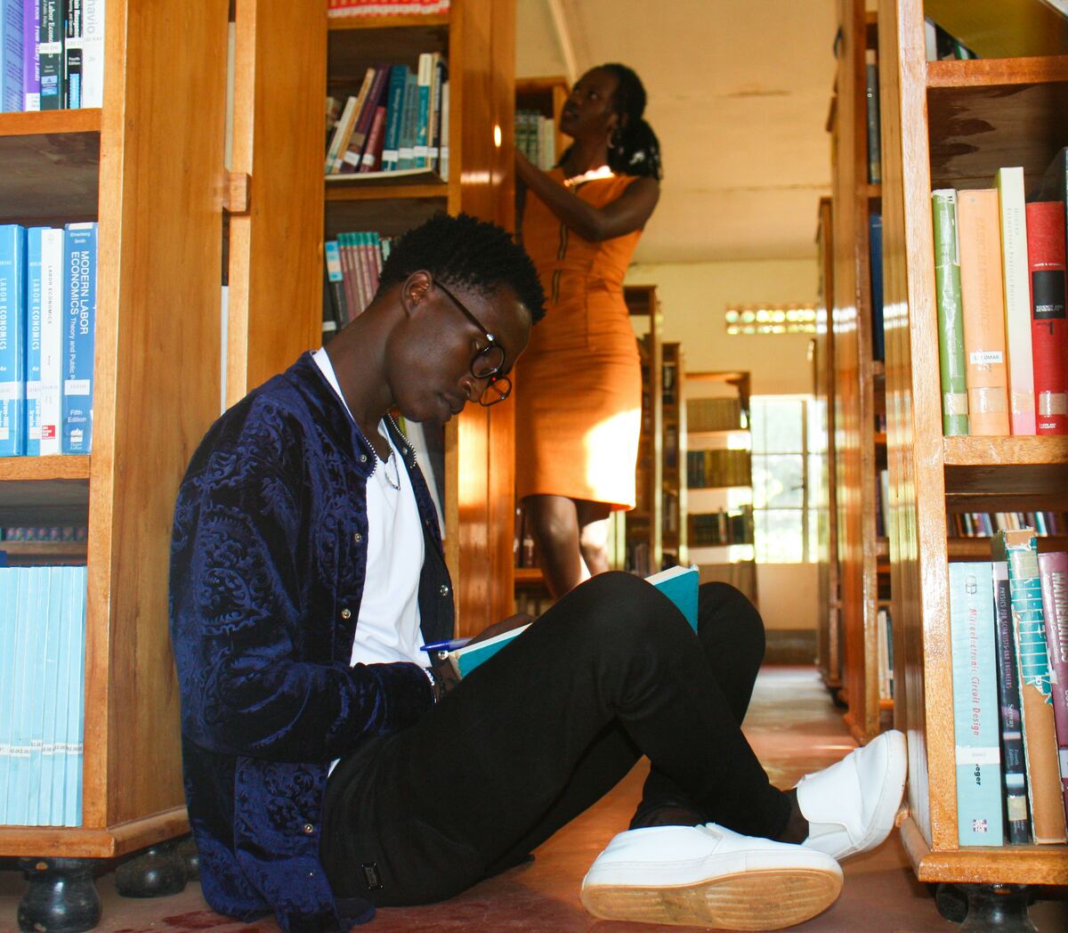 Student reading in library
